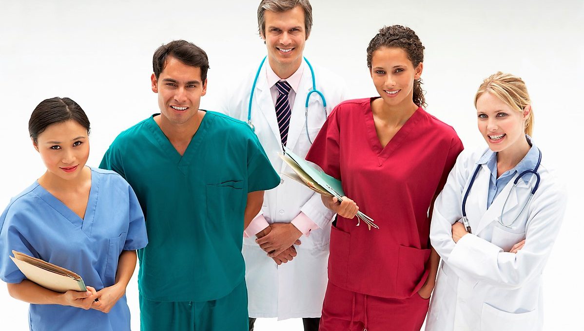 Image of a group of male and female medical providers of different ethnicities smiling for a photo
